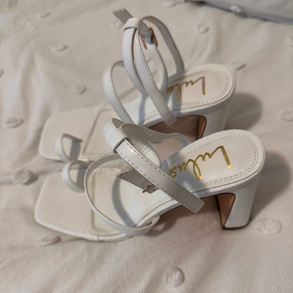 Lulu’s white heels